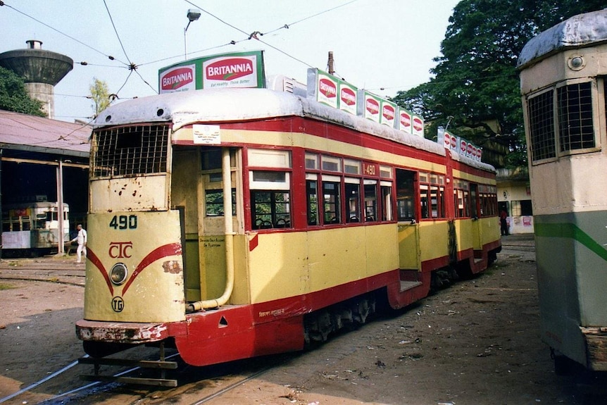 A brightly painted (red and yellow) tram in Kolkata in 1996