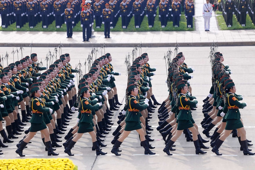 Female military personnel march in Ba Dinh Square to celebrate the 70th anniversary of Vietnam's independence from France.
