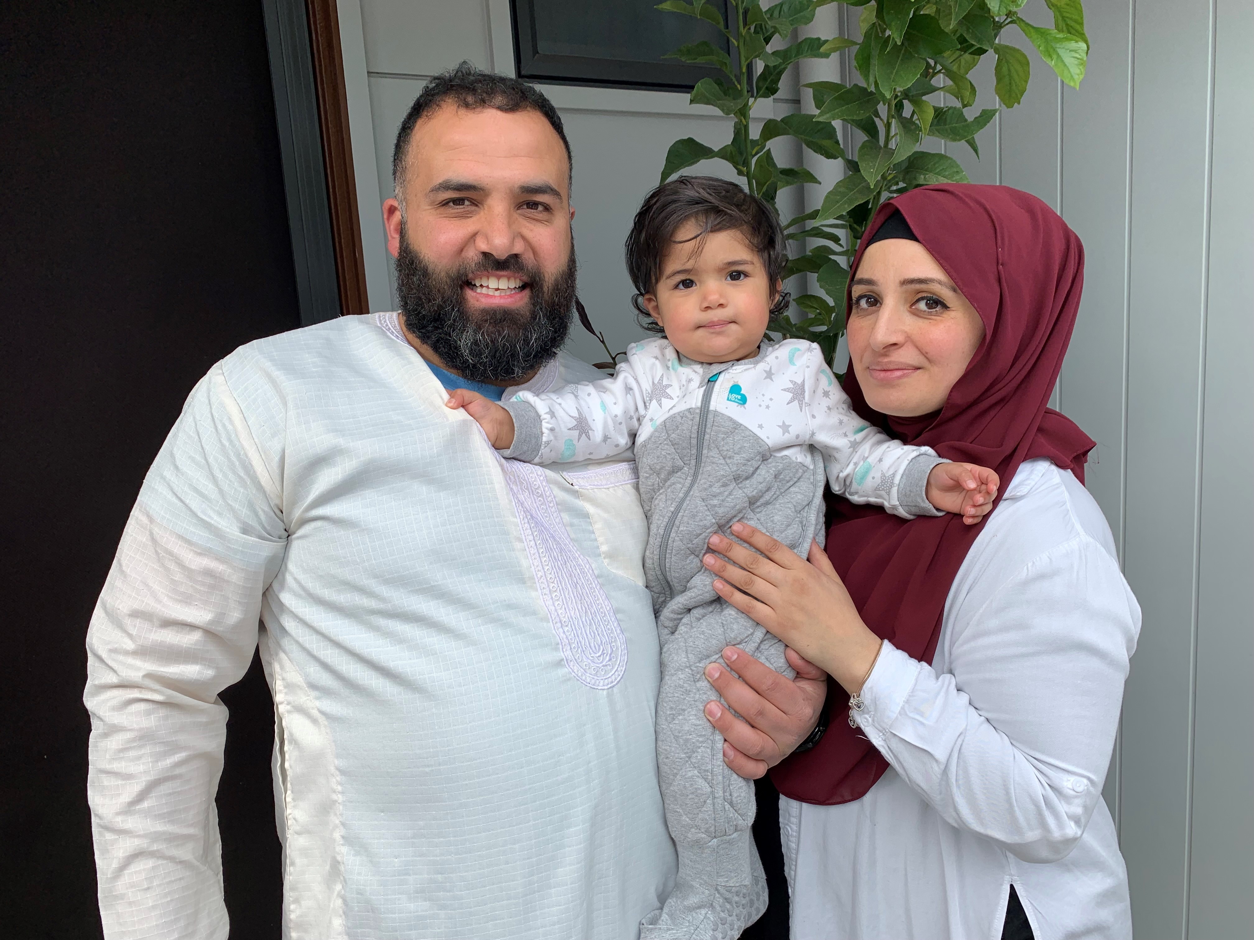 a man and a woman with a young child