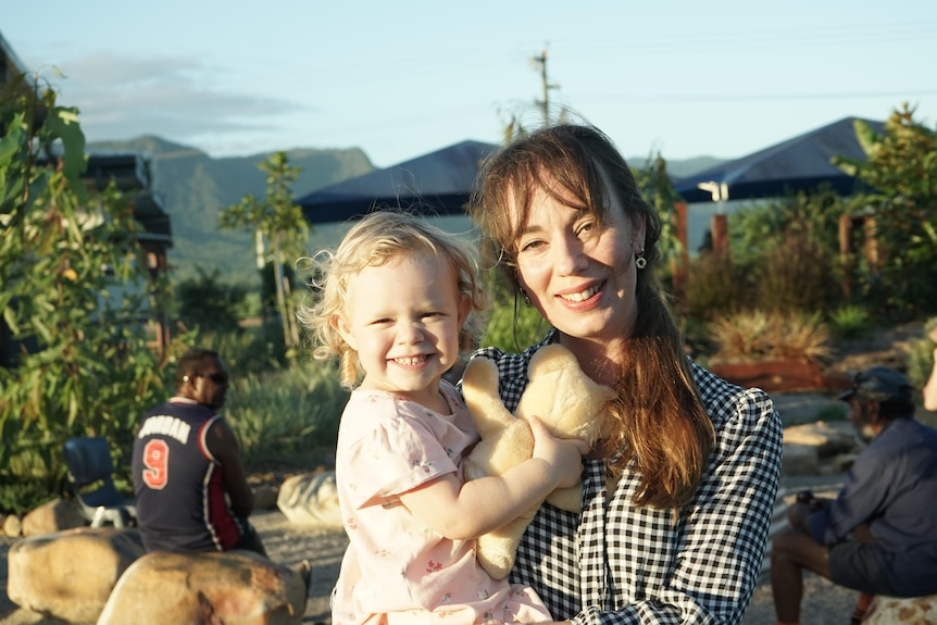 Woman holding a toddler