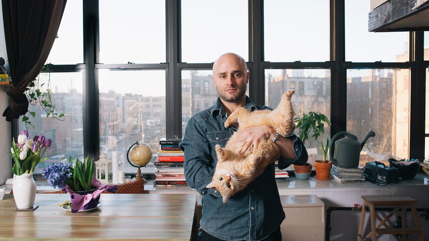 A portrait of a man and his cat by Brooklyn photographer David Williams.