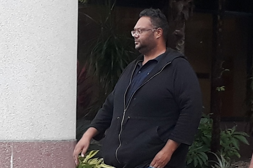 Two men walk out of a Cairns Courthouse