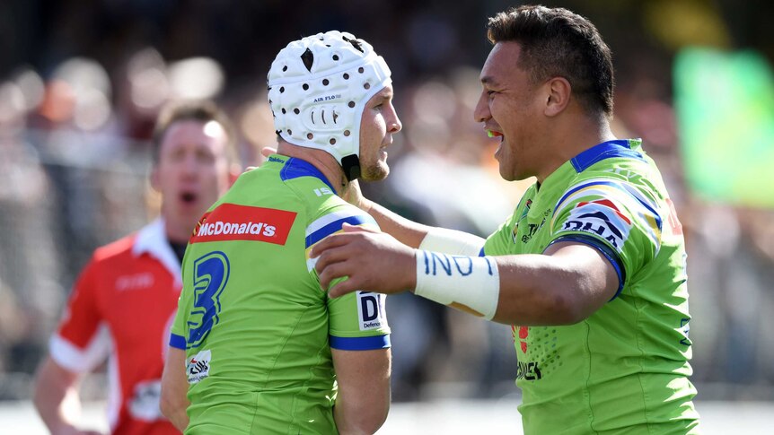 Jarrod Croker is congratulated by Josh Papalii after his try for Canberra against Wests Tigers