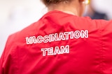 A red shirt with 'vaccination team' written on the back.