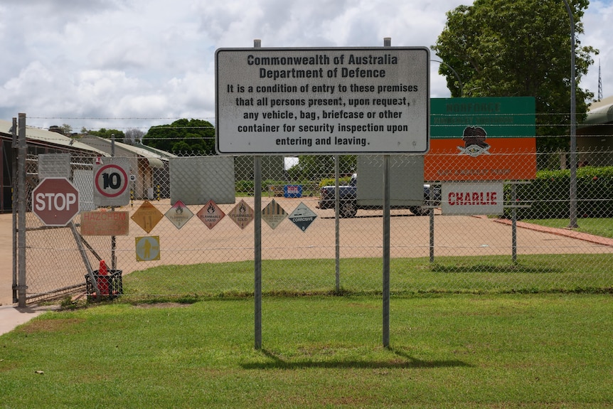 a sign describing a commonwealth army base and a depot behind