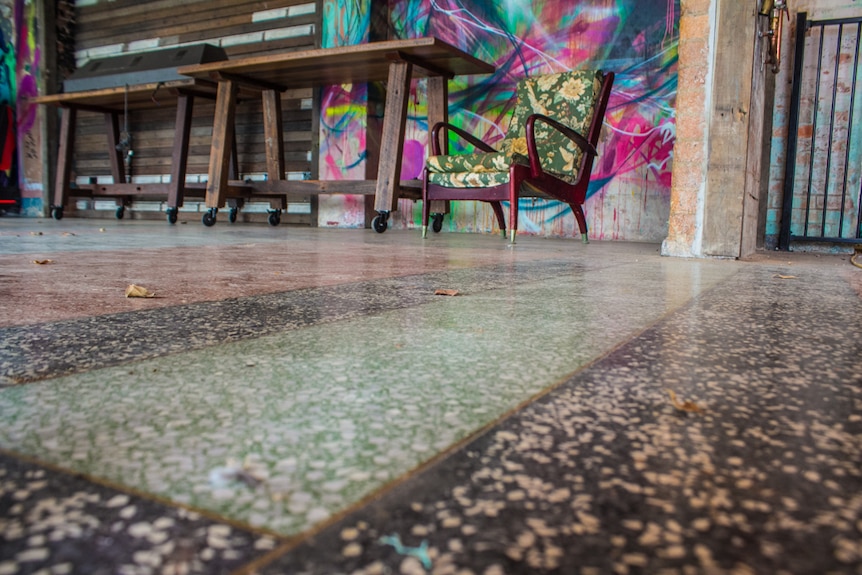 Terrazzo floor with brass seams.