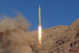 A ballistic missile is launched and tested in an remote looking and undisclosed location in Iran.