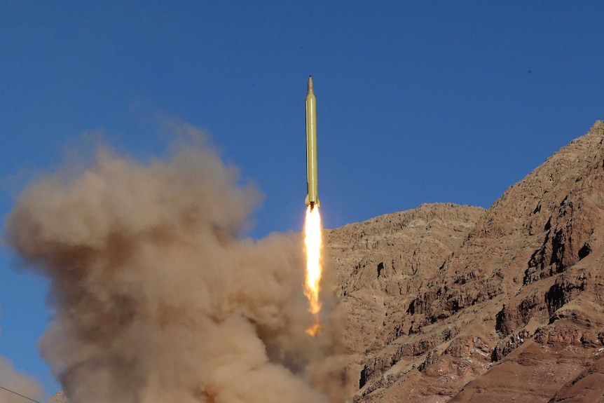 A ballistic missile is launched and tested in an remote looking and undisclosed location in Iran.