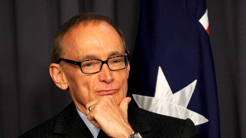 Bob Carr listens to Julia Gillard