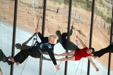 Virgin CEO Richard Branson abseils down the side of the newly dedicated New Mexico spaceport.