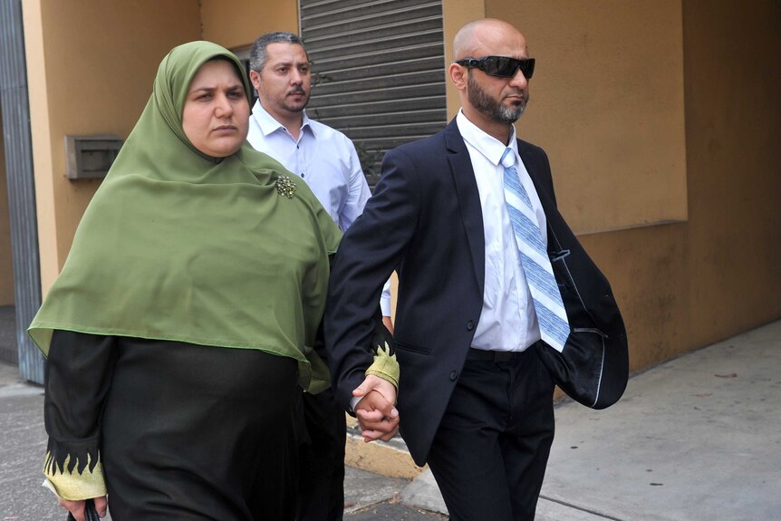 Hosayn El-Dennaoui and Alyaa El-Dennaoui, parents of missing toddler Rahma El-Dennaoui leave court, November 6, 2012.