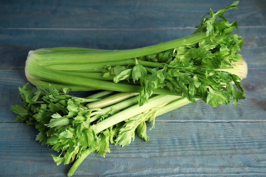 Two celery bunches on a table