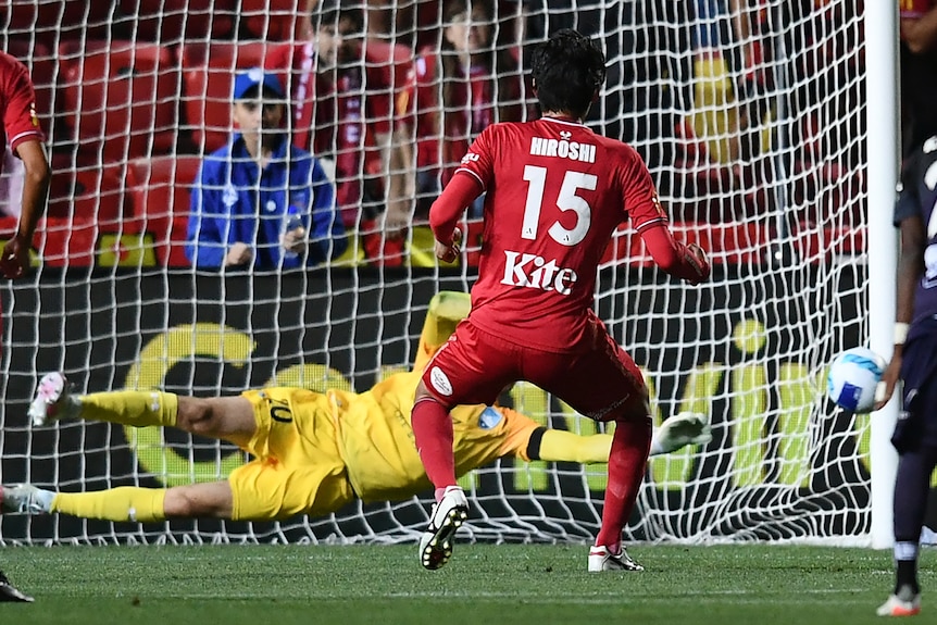 Sydney FC goalkeeper Thomas Heward-Belle saves a penalty shot from Adelaide United's Hiroshi Ibusuki 