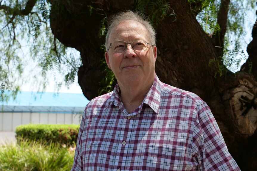 Professor Jim Pratley standing in front of a tree outside of Charles Sturt University.