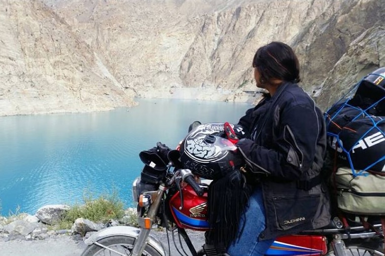 Zenith looks at Attabad Lake in Gilgit Baltistan while on her bike