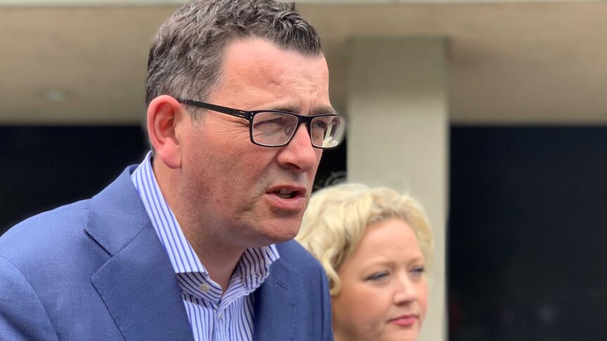 Daniel Andrews talking with Jill Hennessy in the background.