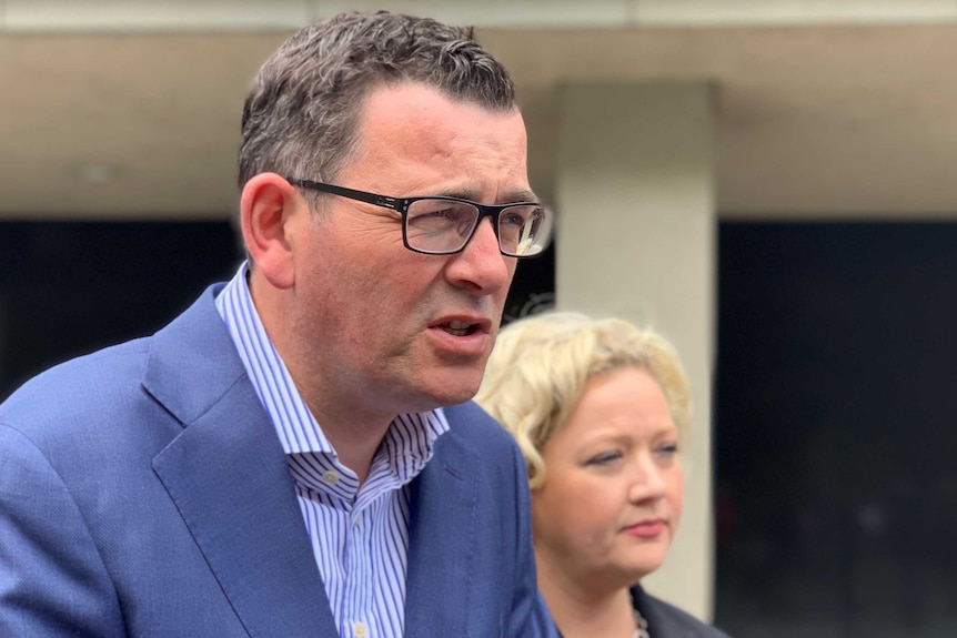 Daniel Andrews talking with Jill Hennessy in the background.