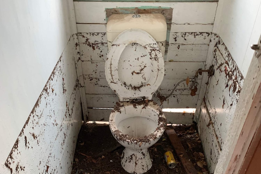 A toilet was submerged in the torrential downpour at Woollongabba.