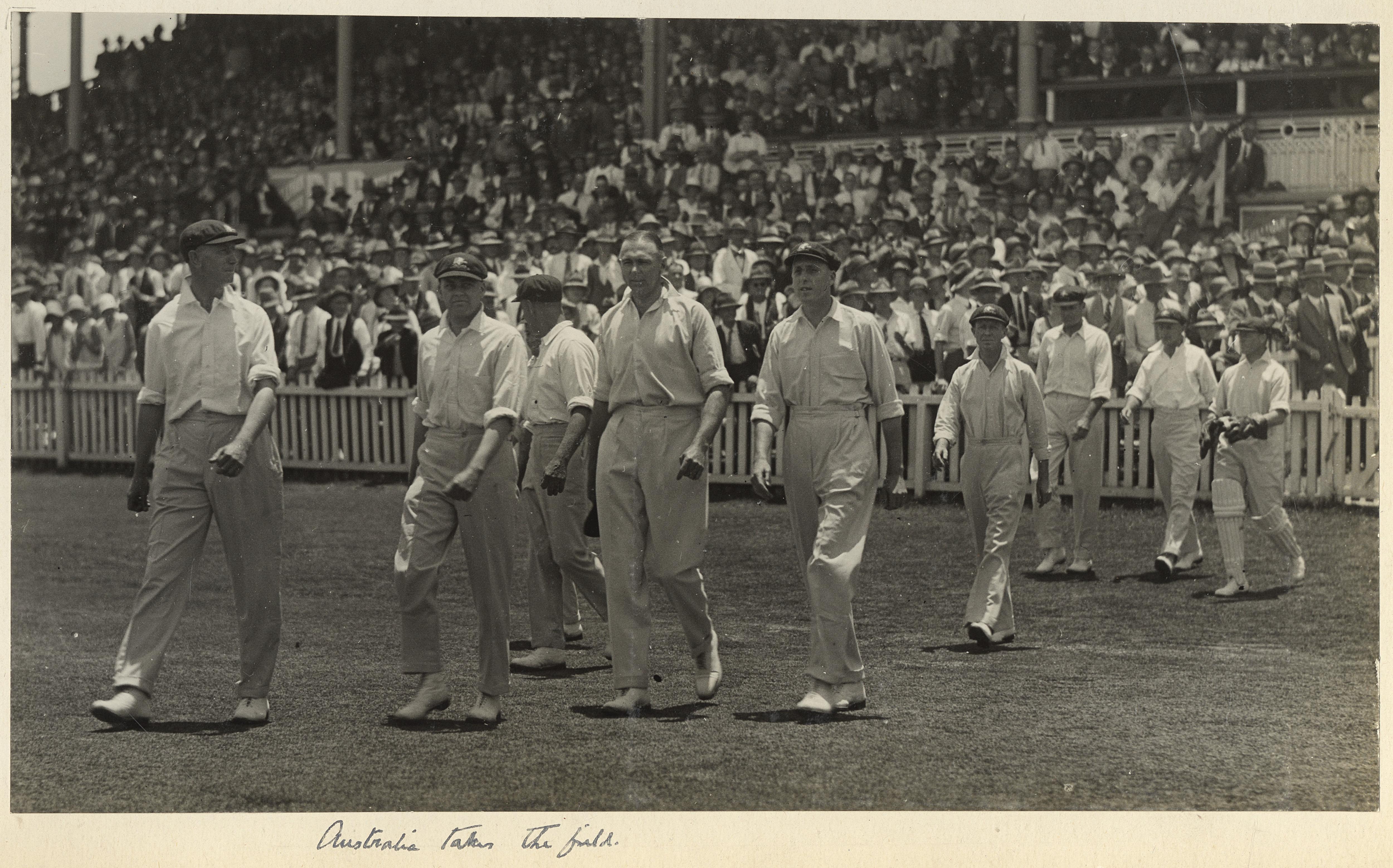 Australia's team walk onto the field