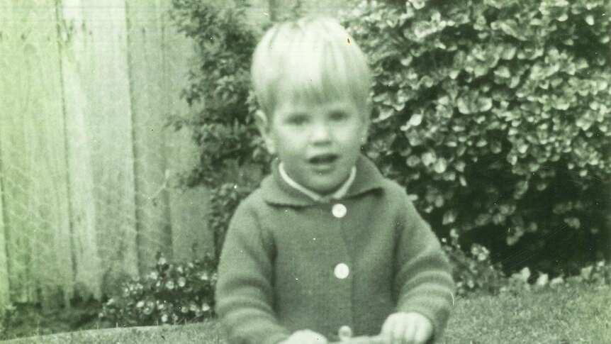 Tim Nicholls aged 3, riding a toy tractor, date and location unknown