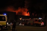 Fire has destroyed several shops at Cannonvale Shopping Centre
