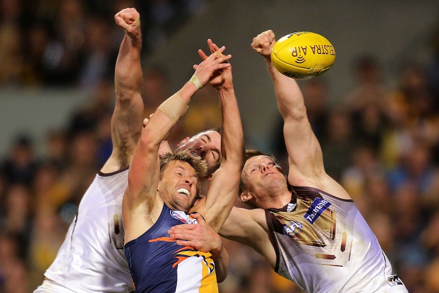 West Coast and Hawthorn fight for the ball