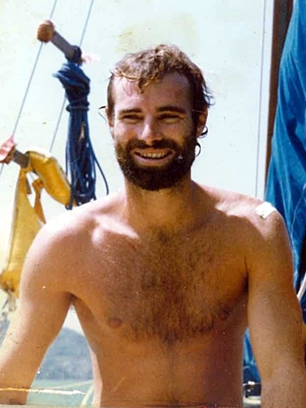 Old photo of a man on a yacht.