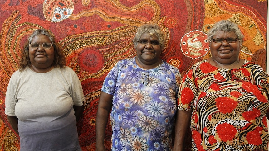 Aboriginal artists Maringka Tunkin, Freda Brady and Yaritji Tingila Young from Tjala Arts in Alice Springs