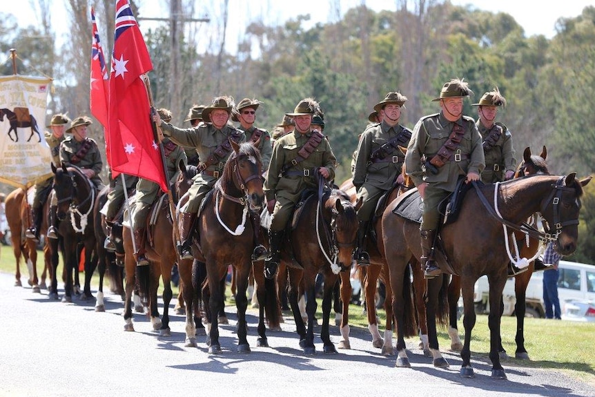 Horsemen dressed in Light Horse Brigade regalia lead the 1915 Kangaroo March re-enactment