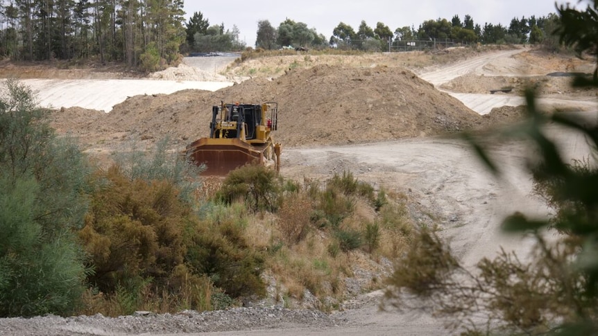 An earth-moving machine at work at a mine site.