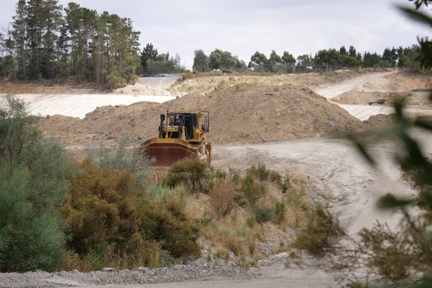 An earth-moving machine at work at a mine site.