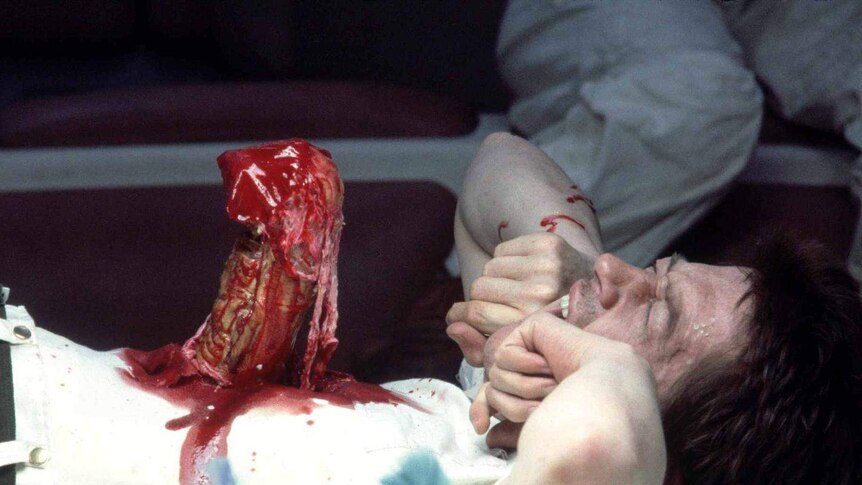 Alien comes out from John Hurt's stomach in the 1979 film Aliens