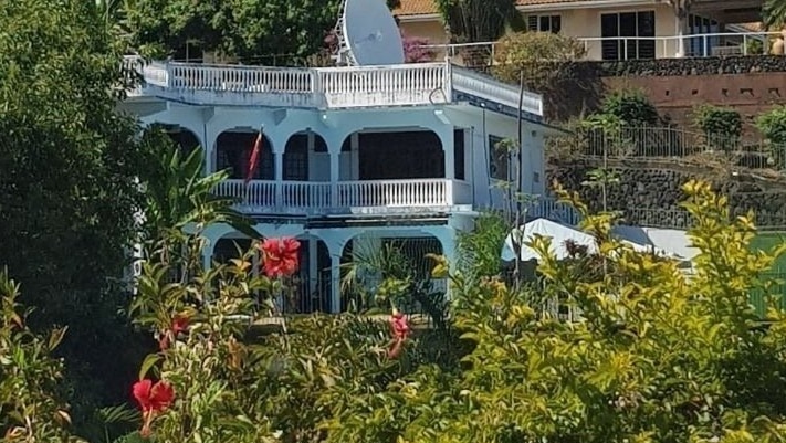 The Chinese Consulate in French Polynesia. It has a large satellite dish on top, and is a French colonial style mansion.