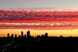 An aerial shot of Perth's CBD skyline at dusk looking south from Mount Lawley