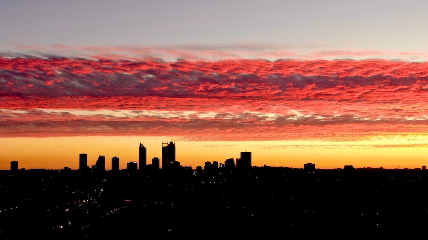 An aerial shot of Perth's CBD skyline at dusk looking south from Mount Lawley