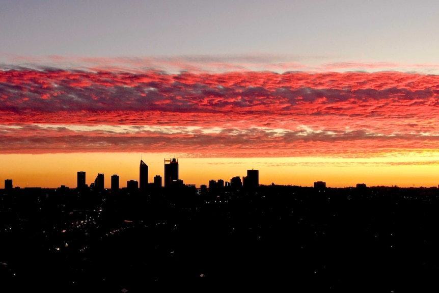 An aerial shot of Perth's CBD skyline at dusk looking south from Mount Lawley