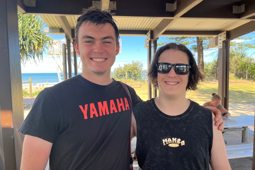 School leavers Gabe Goodchild (left) and Daniel Edwards (right) stand together at Alexandra Headland Beach.