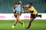 Waratahs' Michael Hopper evades a tackle from Curtis Rona of the Western Force on February 25, 2017.