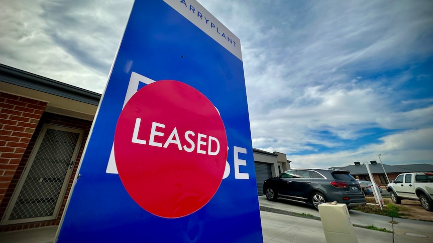 "Leased" sign outside house