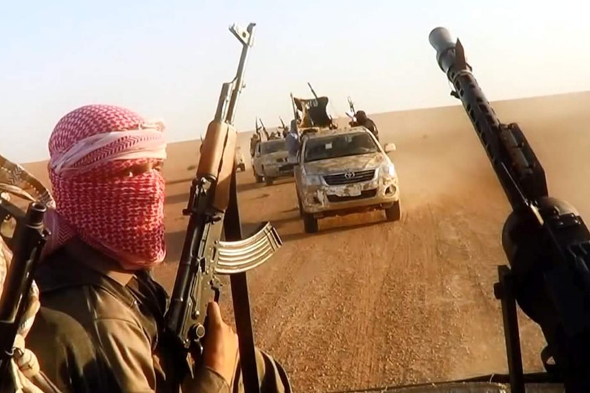 ISIS militants driving near Tikrit