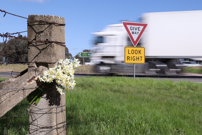 Flowers placed near the scene of a fatal crash on the Hume Freeway near Chiltern