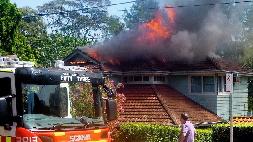 Flames pour from a house in Chatswood West on the lower North Shore of Sydney.