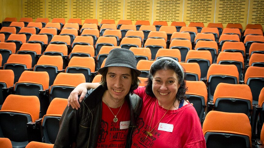 Matthew Wauchope and Lee Witczak in front of theatre chairs.