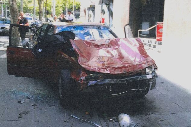 A damaged baby pram stuck in the bonnet of James Gargasoulas' wrecked car.