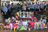 Crowd gathers for memorial service at Moorooka