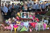 Crowd gathers for memorial service at Moorooka
