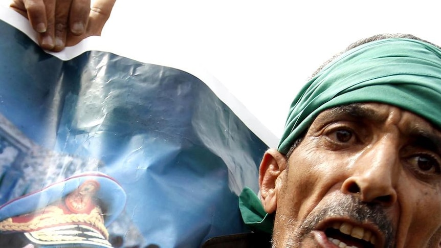 Defiant: A supporter of Moamar Gaddafi in Sabratha, west of Tripoli.
