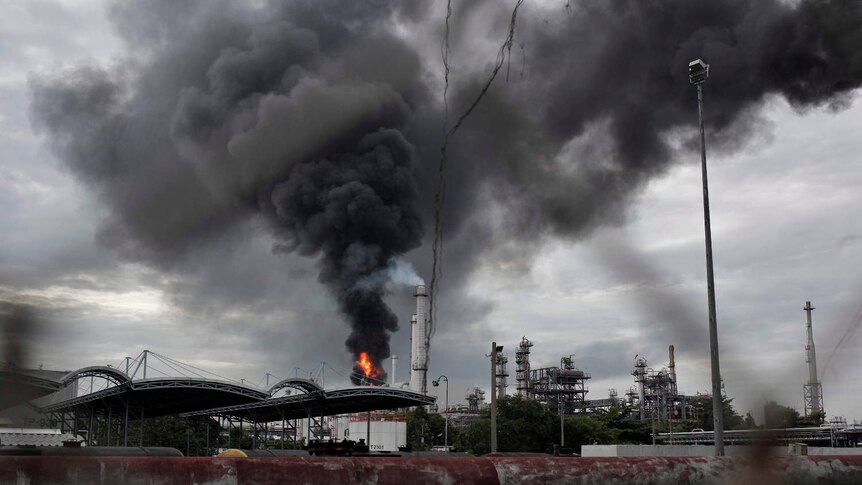 Smoke is emitted from an oil refinery after a fire broke out in Bangkok