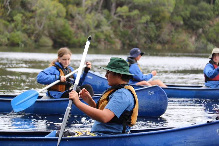 Kids at the Marlo campus in canoes