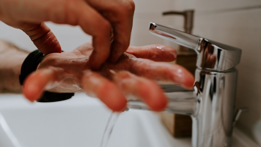 Generic image of person washing their hand